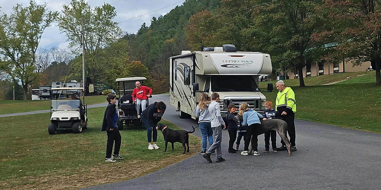 Family camping with their dog at Stony Fork Creek Campground in Pennsylvania