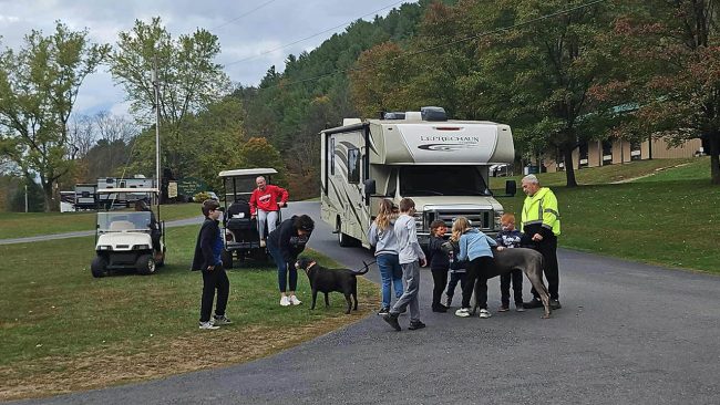 Family camping with their dog at Stony Fork Creek Campground in Pennsylvania